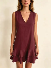 Burgundy tiered ruffle mini dress with V-neck and sleeveless design.