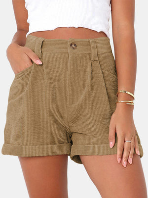 Camel corduroy high-waist shorts with pleats and cuffed hem.