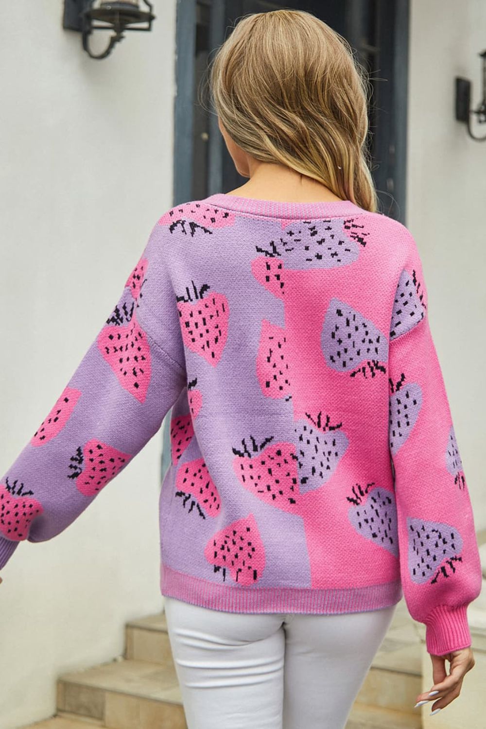Strawberry patchwork V-neck cardigan in pink and purple acrylic with long sleeves.
