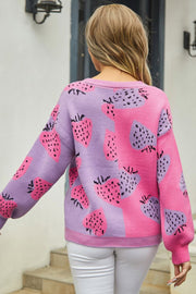 Strawberry patchwork V-neck cardigan in pink and purple acrylic with long sleeves.