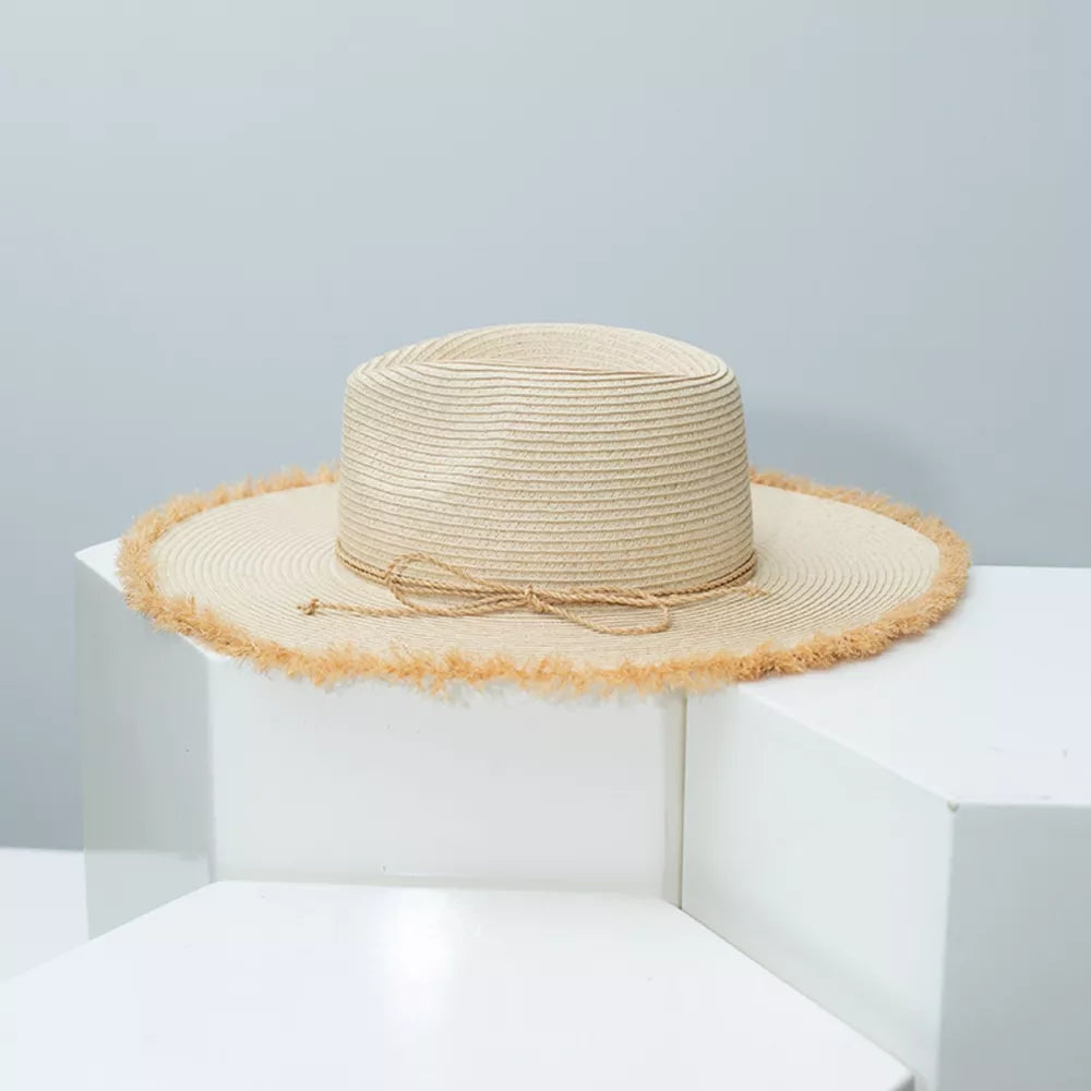 Beige straw sun hat with frayed brim and tie detail