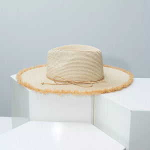 Beige straw sun hat with frayed brim and tie detail
