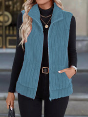 Sky blue fleece zip-up vest with pockets and a stand-up collar.