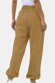 Slouchy sweatpants in tan with gathered cuffs and elastic waistband.