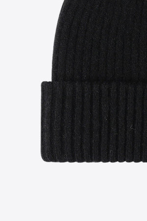 Black ribbed acrylic beanie with a cuffed hem