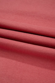 Burnt coral t-shirt fabric with a soft, textured knit detail
