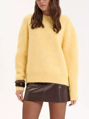 Cozy knit sweater in pastel yellow with relaxed fit, crew neck, and long sleeves.