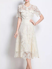 Cream lace buttoned dress with short sleeves and midi skirt.
