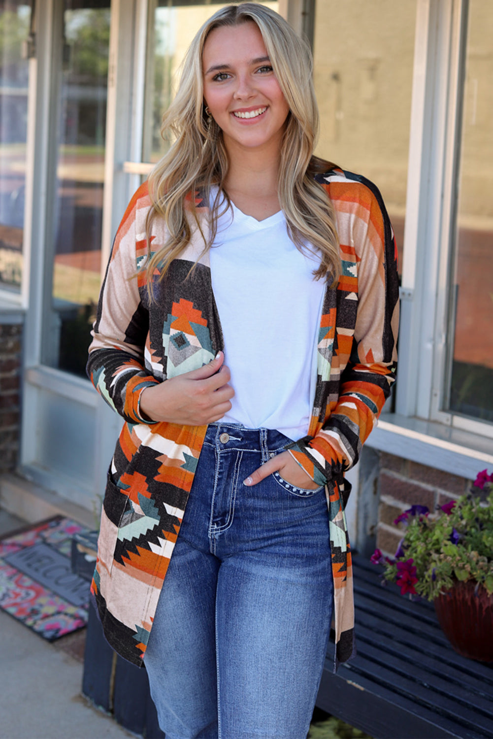 Southwestern print open cardigan with long sleeves and pockets in multicolor.