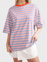 Oversized striped tee with dropped sleeves and orange neckline in pink and blue stripes.