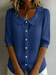 Peacock blue button-down shirt with Peter Pan collar and puff sleeves.