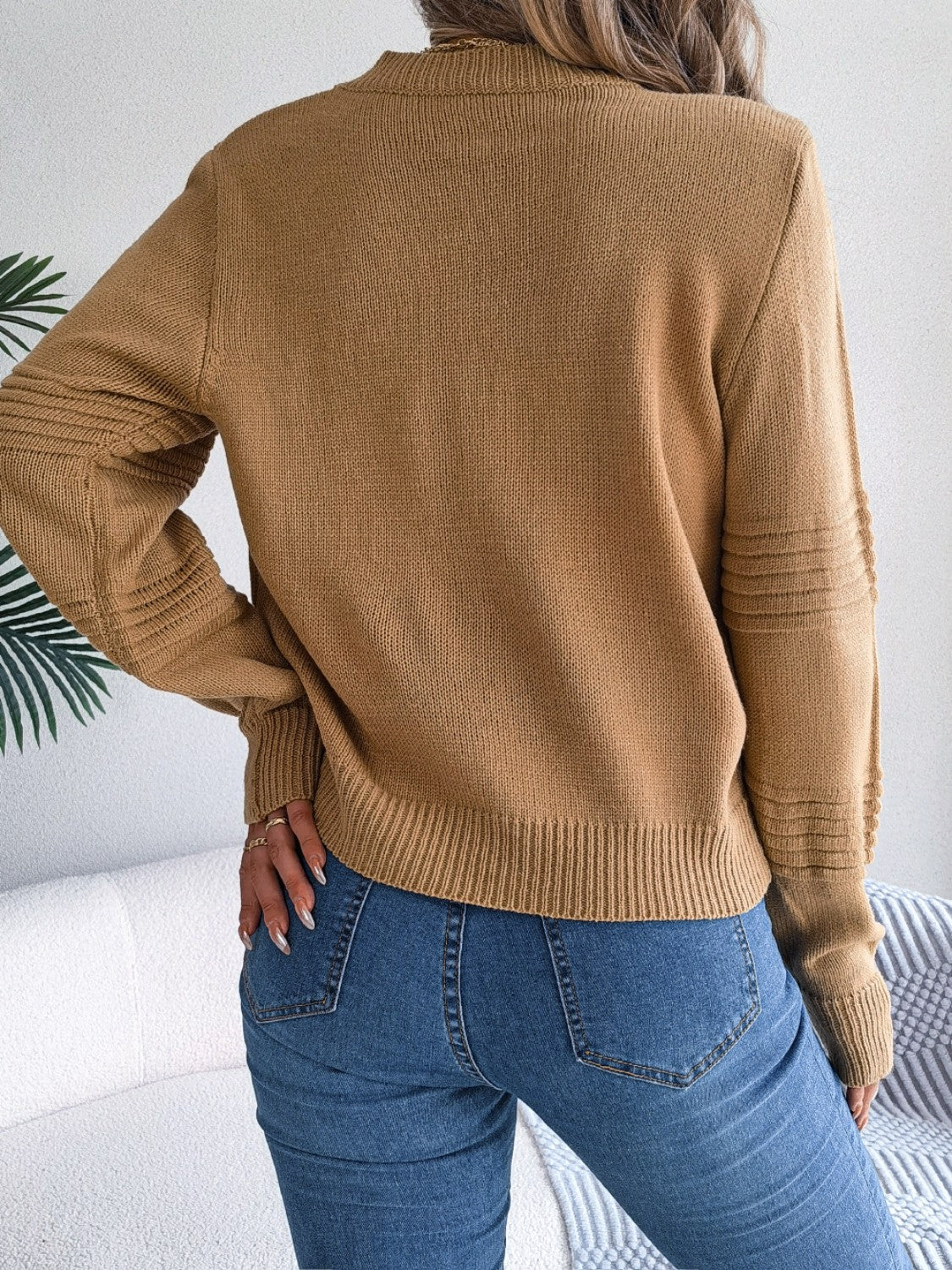 Camel ribbed yoke knit sweater with textured sleeve details and crew neck.