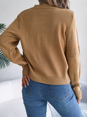 Camel ribbed yoke knit sweater with textured sleeve details and crew neck.