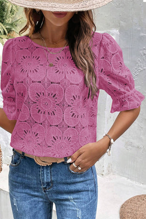 Red-violet floral eyelet blouse with puff sleeves and ruffled cuffs.