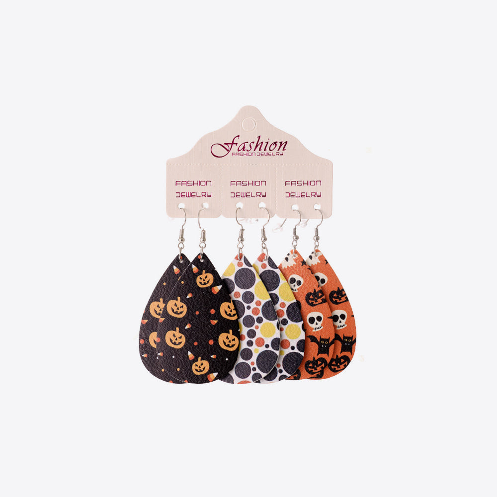 Spooky print teardrop earrings with pumpkins, candy corn, skulls, and cats.
