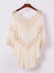 Apricot flowy cover-up with crochet trim and V-neckline.