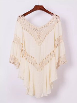 Apricot flowy cover-up with crochet trim and V-neckline.