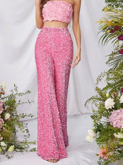 Pink sequin wide leg pants with a high waist and flowy silhouette.