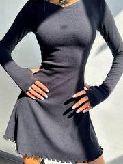 Black ribbed knit long-sleeve mini dress with v-neck and lettuce hem.