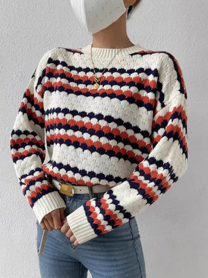 Textured striped knit sweater with bubble knit detail in white, orange, and navy.
