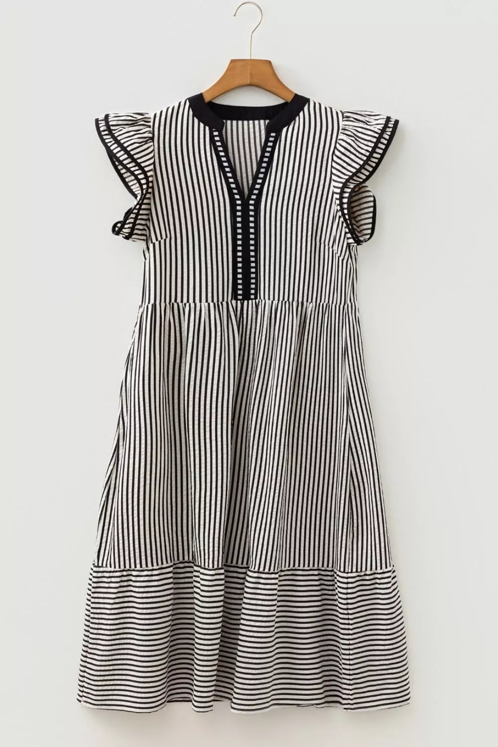 Black and white striped cotton midi dress with tiered skirt and ruffle sleeves.