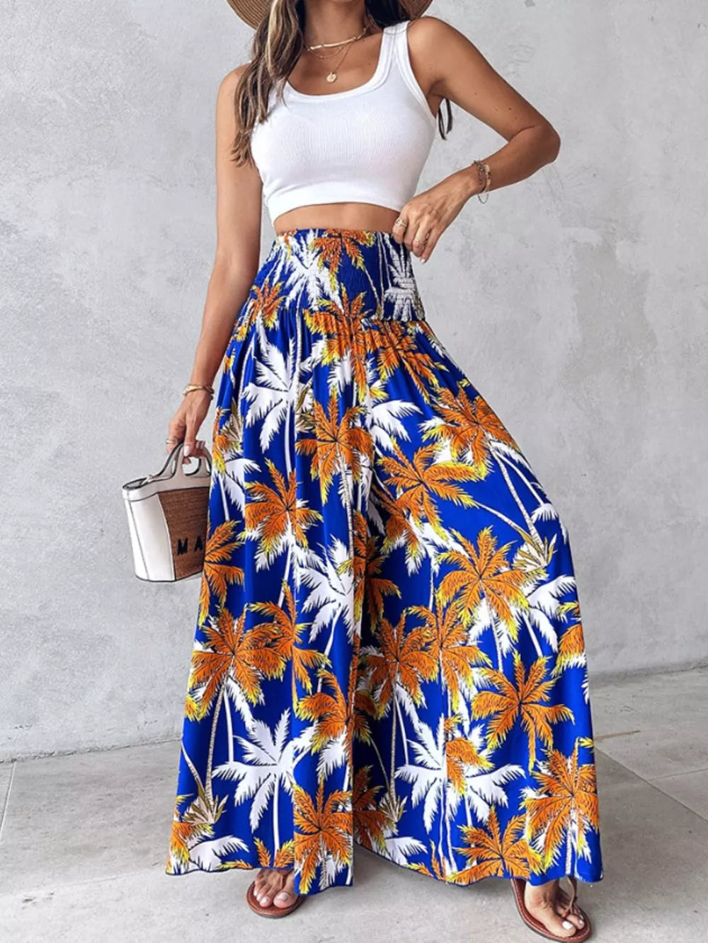 Bohemian print wide leg pants in Royal Blue with smocked waist and palm tree pattern.