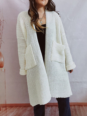 White chunky knit cocoon cardigan coat with pockets and rolled cuffs.