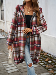 Draped plaid cocoon hoodie jacket in red and brown plaid with a zipper and drawstring hood.