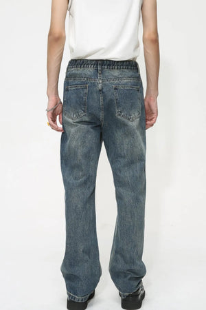 Baggy denim jeans in medium wash with subtle fading and a relaxed fit.