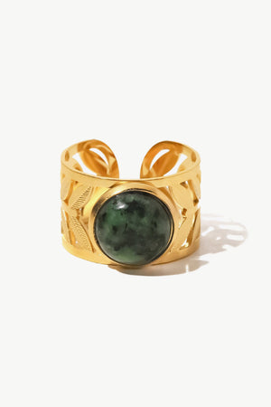 Gold ring with leaf cutouts and a green malachite stone