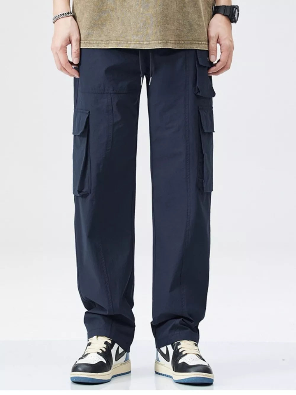 Dark blue utility cargo sweatpants for men with wide legs and multiple pockets.