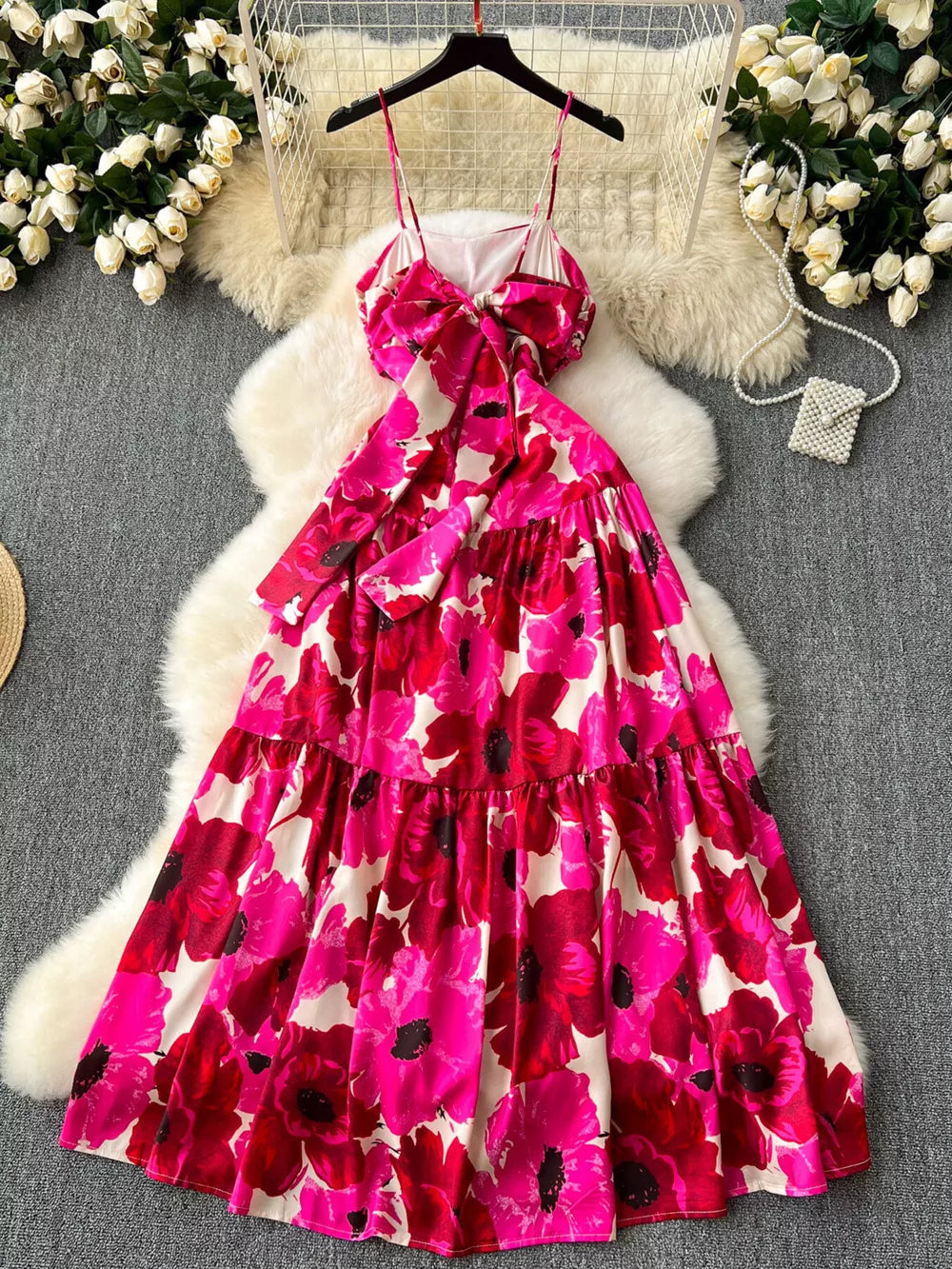 Vibrant floral tiered cami maxi dress with a bow detail and spaghetti straps.