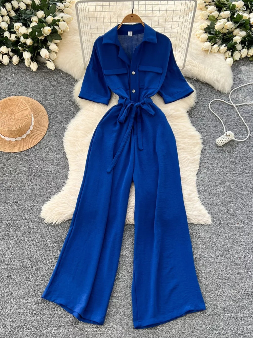 Blue belted wide-leg maternity jumpsuit with pockets and button front