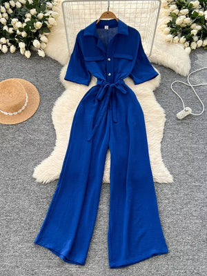 Blue belted wide-leg maternity jumpsuit with pockets and button front