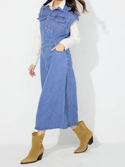 Sleeveless denim midi dress in medium wash with button details and a side slit.