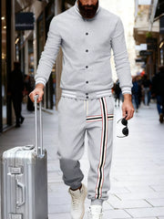 Men's light gray tracksuit with striped details on pants and jacket sleeves.