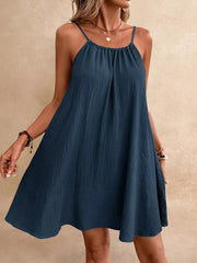 Dark Navy spaghetti strap mini dress with gathered neckline and textured fabric.