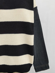 Black and cream striped knit sweater with black denim sleeves.