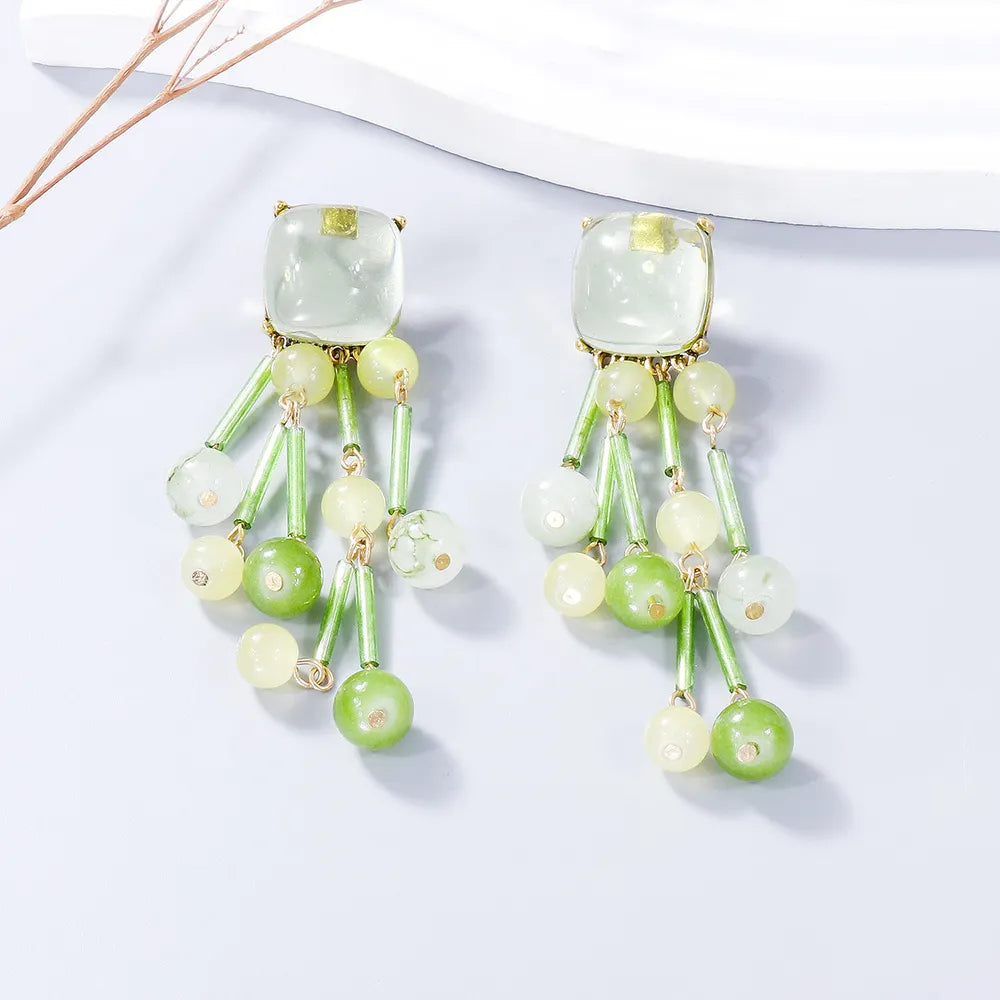 Beaded cascade statement earrings in Gum Leaf green with acrylic and alloy beads.