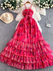 Pink floral mesh maxi dress with tiered ruffle skirt and ruched bodice.