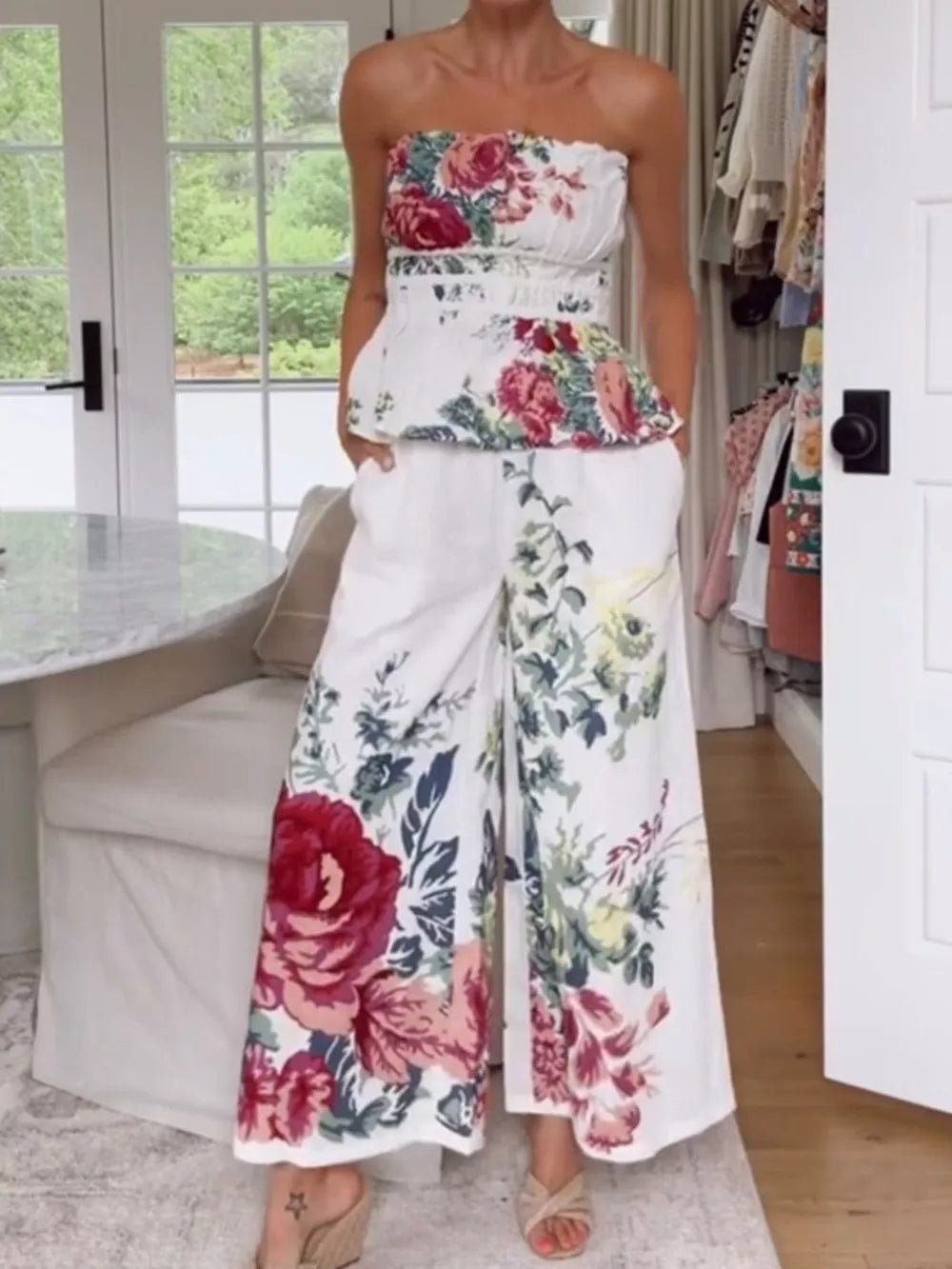 Chic floral ruched strapless top and wide-leg pants set in white polyester.