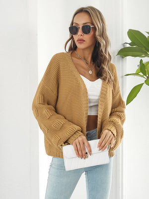 Camel textured sleeve open-front knit cardigan with a relaxed fit.