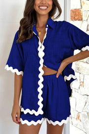 Royal blue co-ord set with white scalloped trim on shirt and shorts.
