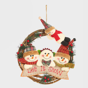 Festive wreath with plush snowmen figures, red scarves, plaid hats, and "Let It Snow" banner.