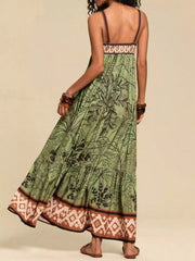 Moss maternity maxi swim dress with tropical print, tiered skirt, and patterned border.