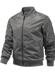 Men's gray zip-up bomber jacket with zippered sleeve pocket and ribbed cuffs.