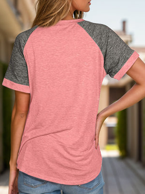 Raglan sleeve tee in pink with dark gray sleeves and crew neck.