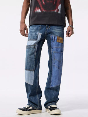 Men's relaxed fit jeans with distinctive blue denim patchwork and distressed details.