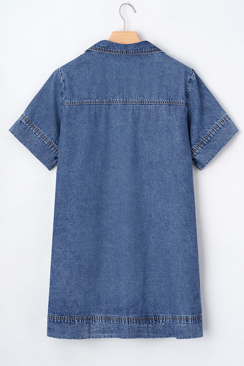 Light blue denim mini dress with short sleeves, collar, and contrast stitching details.