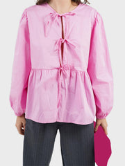 Pink tie-front peplum blouse with voluminous sleeves and tie detail